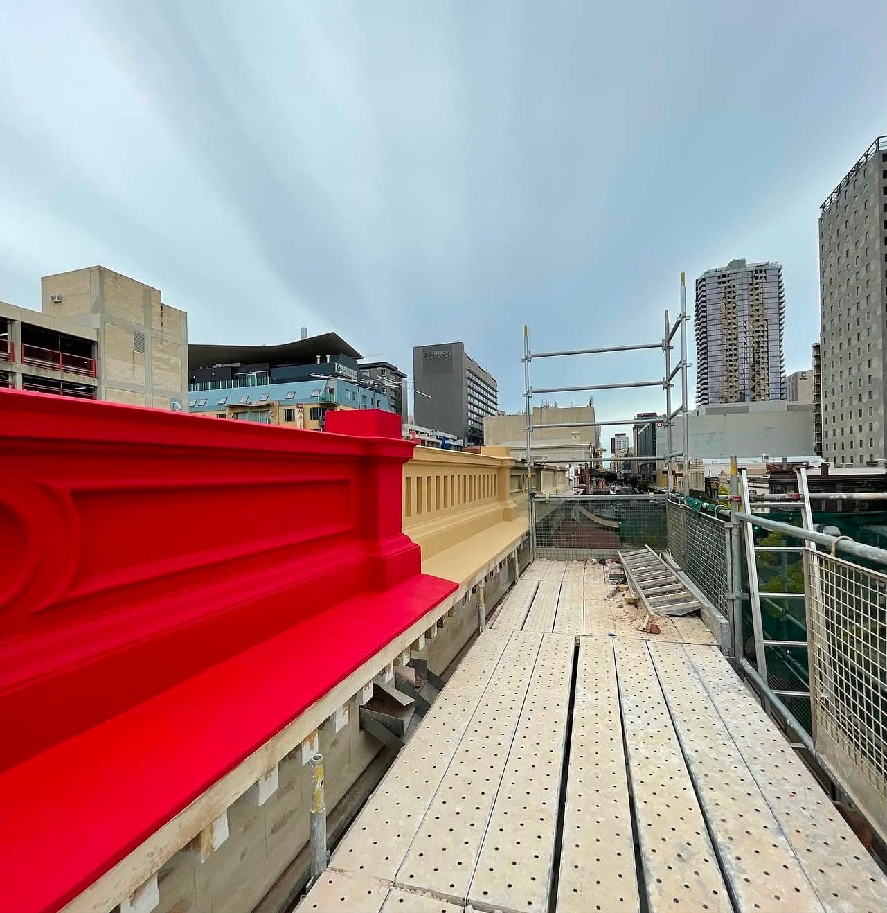 Heritage building painters Adelaide CBD – parapet repainted in red and cream