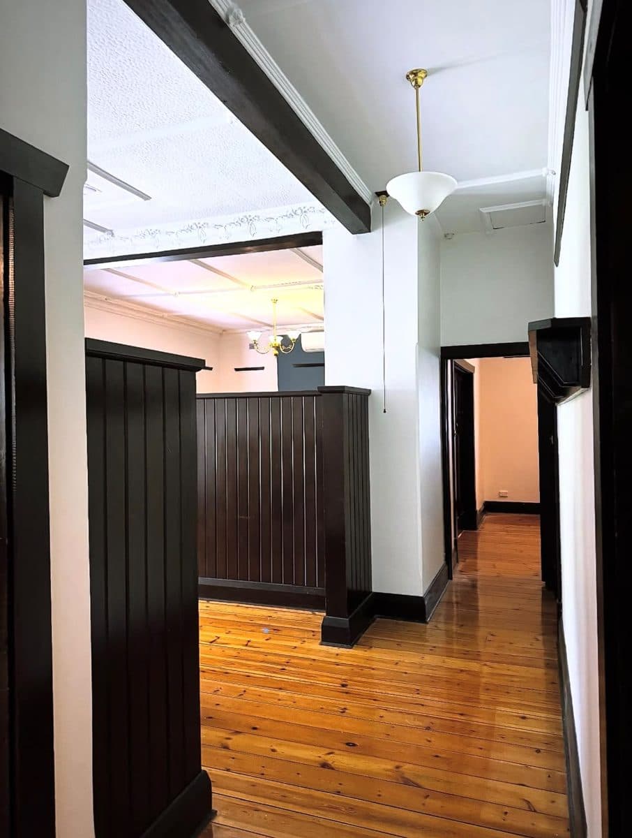 Pre-sale house painting Glenelg – character home interior repainted with white walls and dark timber panelling