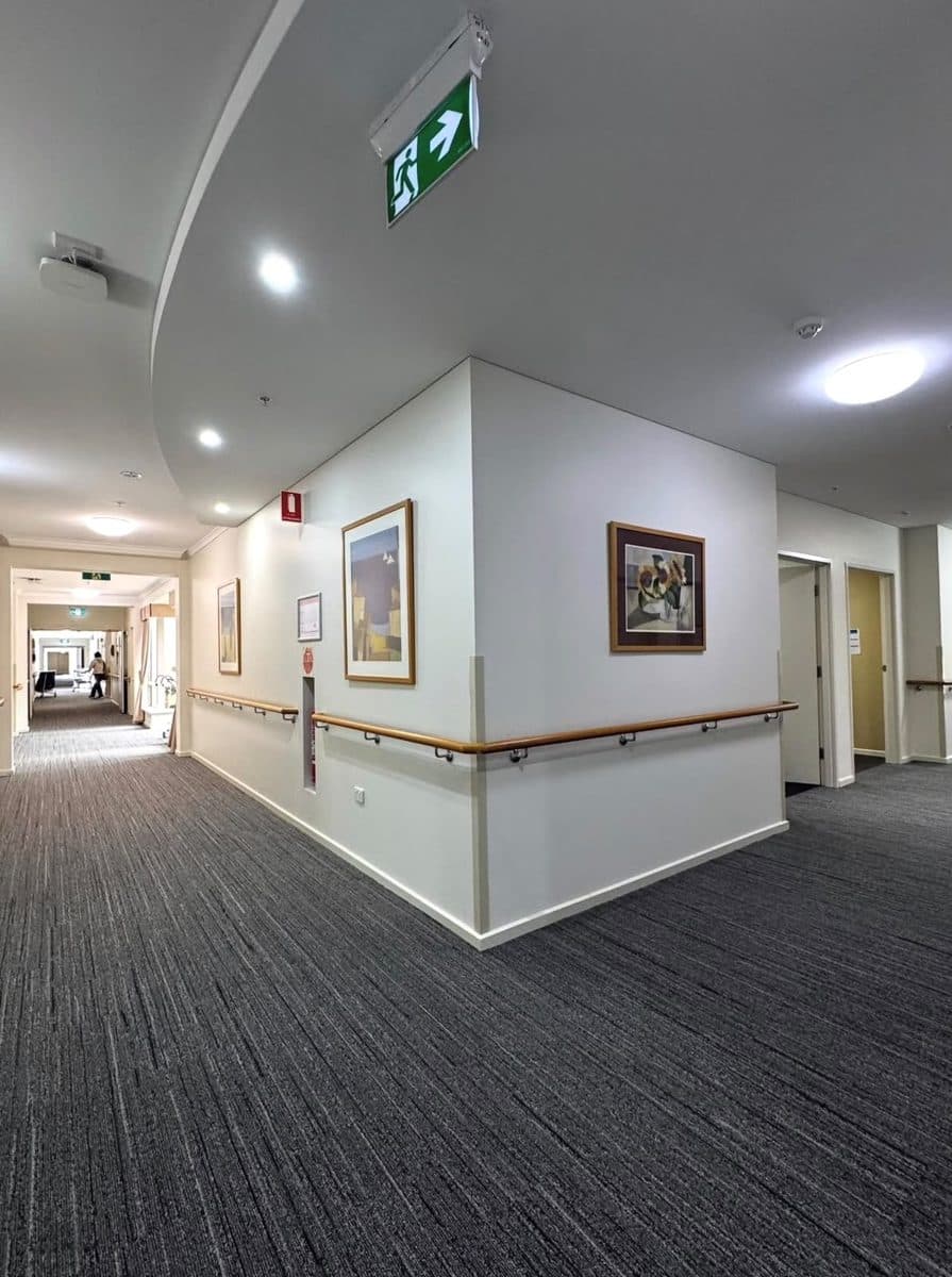 Aged care painters Adelaide – freshly painted corridor walls and ceiling with handrails
